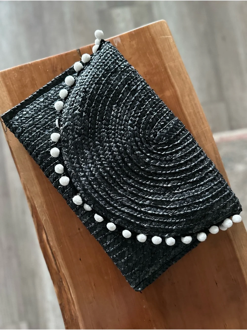 Shiraleah Navy Woven Straw Clutch with White Pom-Pom Trim